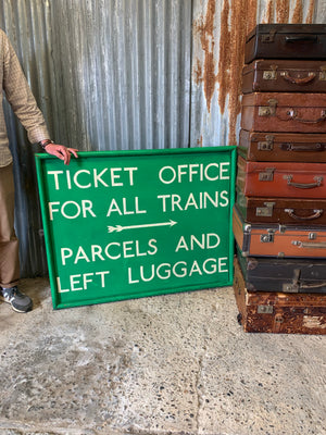 A large hand painted railway ticket office sign