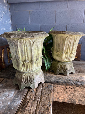 A pair of large lotus pattern cast stone urns