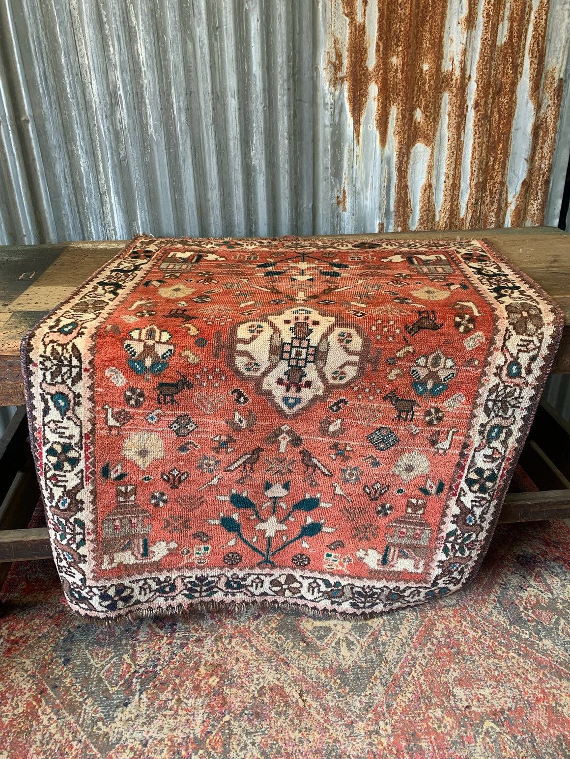 A Persian Qashqai rug featuring birds and beast - 150 x 108cm