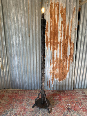 A carved wooden Chinoiserie floor lamp