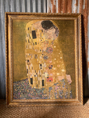 A large copy of The Kiss painting by Gustav Klimt