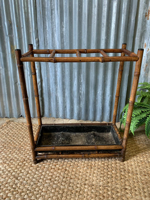 A bamboo stick stand with metal liner