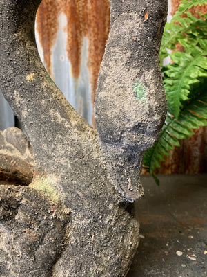 A large terracotta swan planter