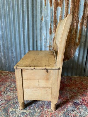 A pine bench seat with storage drawer