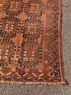 A Persian brown ground rectangular rug- 218cm x 115cm