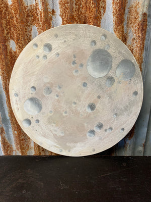 A hand painted wooden fairground moon sign