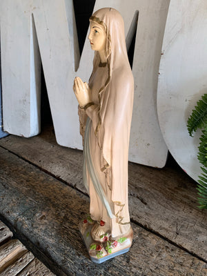 A large plaster Our Lady of Lourdes statue