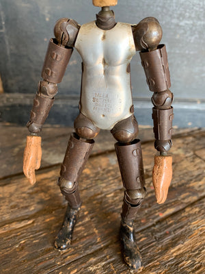 A SABA Bucherer Swiss articulated metal and composition doll 8"