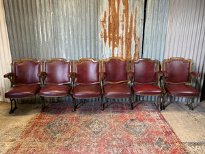 A set of oak theatre or cinema seats