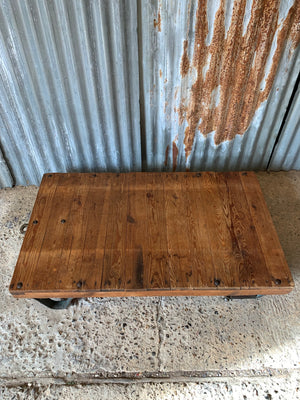 A vintage industrial trolley coffee table