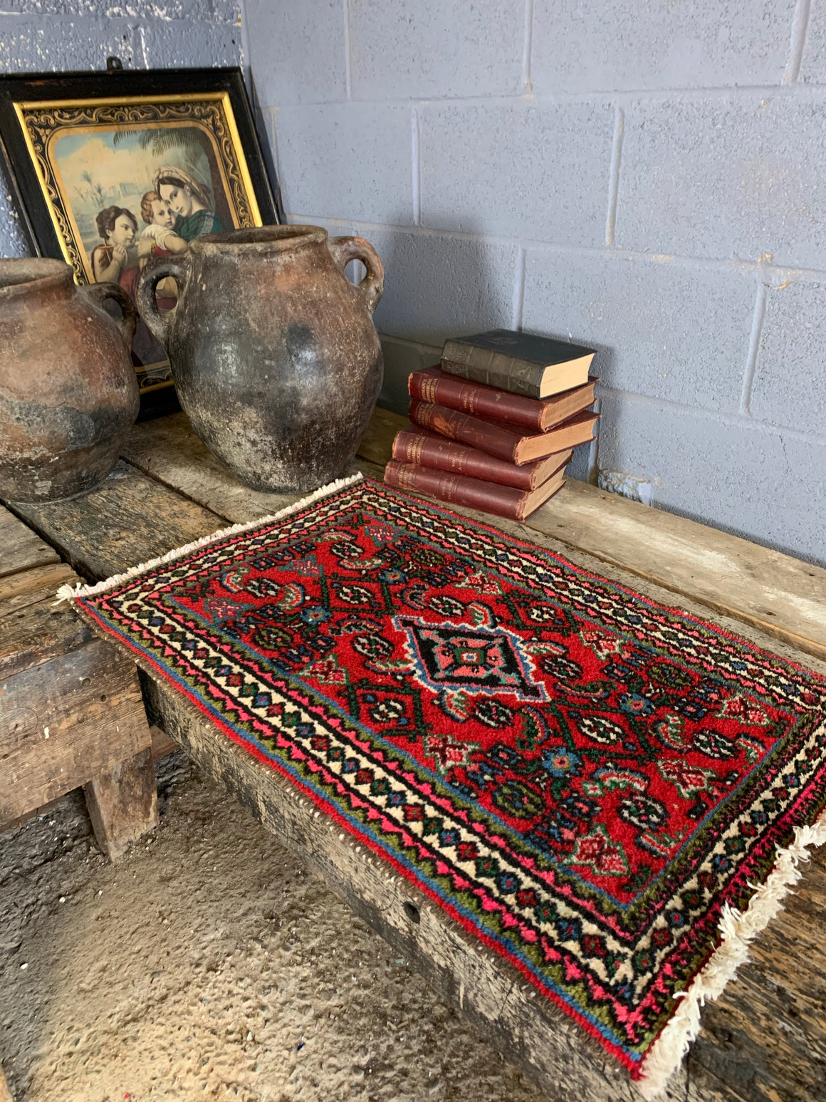 A small hand woven Persian red blue ground rectangular rug