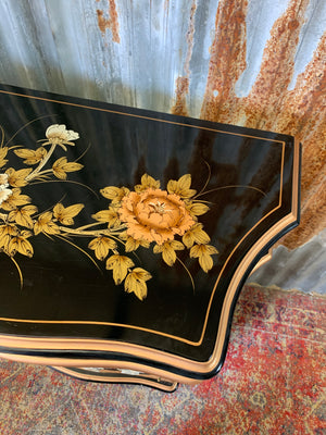 A black lacquered Chinoiserie cabinet