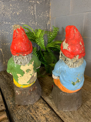 A large pair of cast stone gnome statues