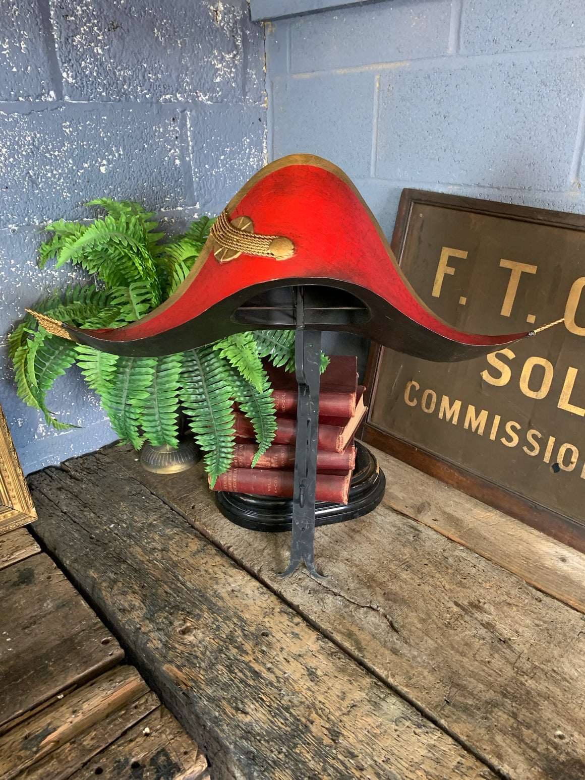 A toleware bicorn hat trade sign