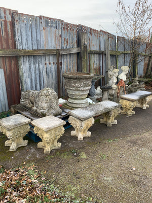 A set of cast stone Triton benches and stools
