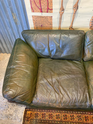 A large 3 seater Modernist Italian sofa in green leather of boat or 'egg' form