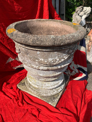 A very large composition stone urn