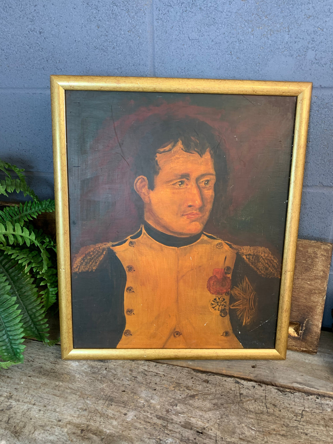 A framed oil on board painting of Napoleon