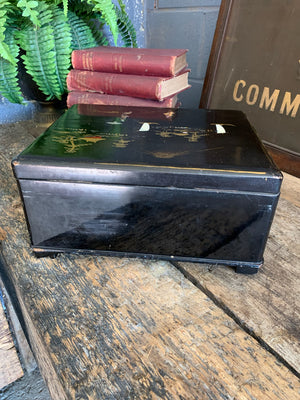 A Japanese black lacquered sewing box