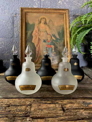 A collection of five Royal Pharmaceutical Society apothecary bottles