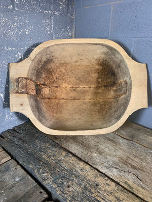 A very large wooden dough bowl