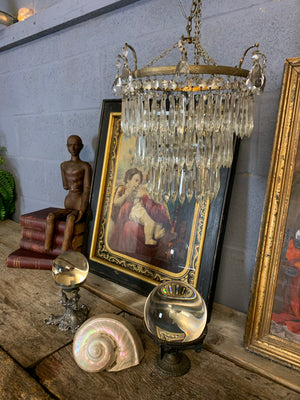 A large gilt three tier crystal icicle droplet chandelier