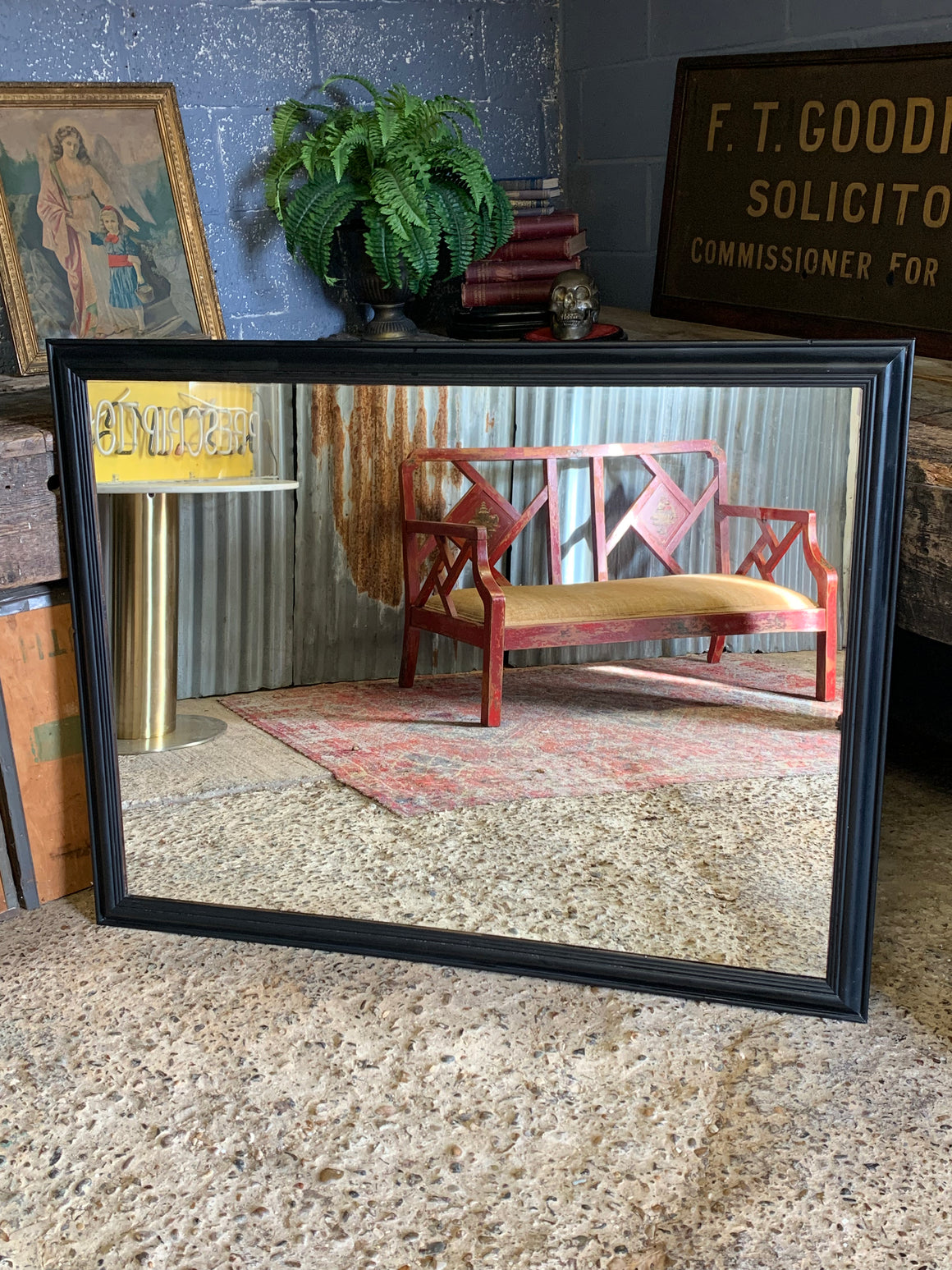 A large rectangular ebonised mirror