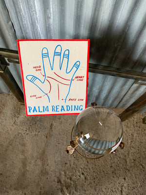 A fairground 'Palm Reading' sign
