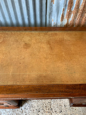 A Victorian tan leather pedestal desk on castors