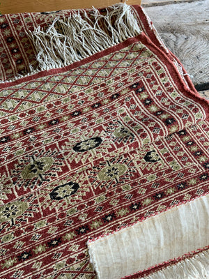 A kilim rectangular red rug