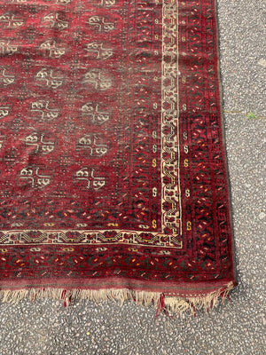 A Persian red ground Bokhara rug - 191 x 136cm