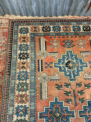 An orange and blue rectangular Persian rug