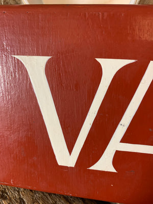 A hand painted wooden 'Vacancies' hotel sign