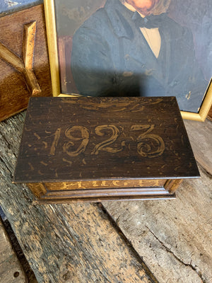 A scumble glaze wooden box inscribed ‘Hugh 1923’