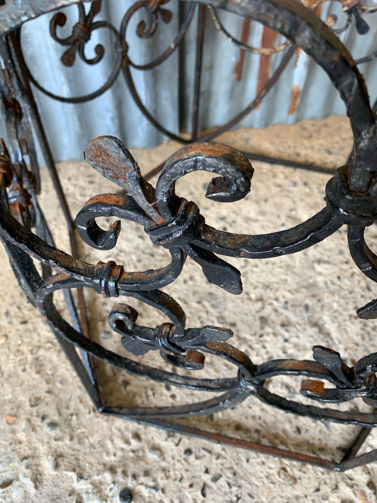 A black wrought iron tree guard - Belle and Beast Emporium