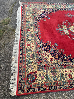A very large red ground Kerman rug - 380cm x 281cm