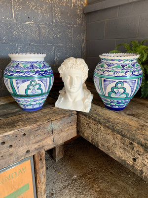 A pair of large glazed urns