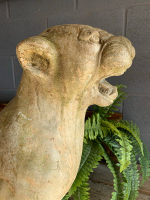 A large weathered cast stone panther statue (62cm)