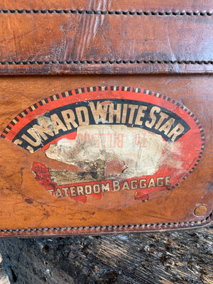 A brown leather suitcase by W W Bridge Ltd