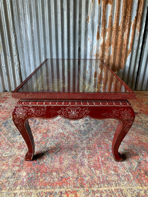 A red lacquered chinoiserie coffee table