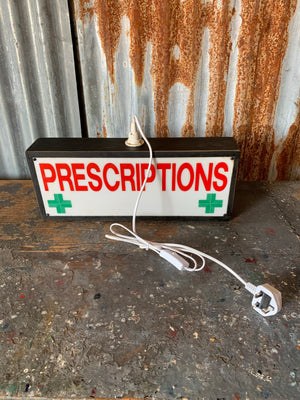 A prescriptions pharmacy illuminated light box advertising sign
