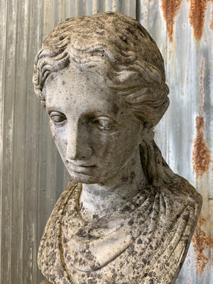 A cast stone classical female bust