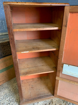 A school cupboard with interior shelving