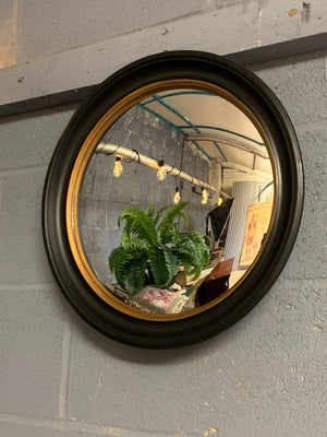 A large black and gold convex mirror ~ 44.5cm