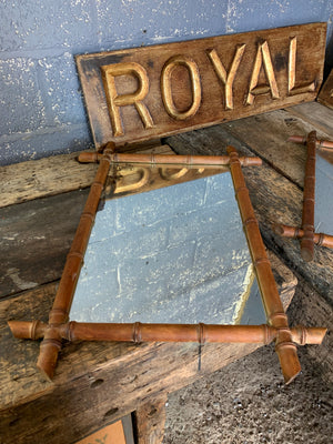 A trio of French faux bamboo wall mirrors
