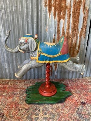 A child's ride on elephant mounted as a fairground galloper