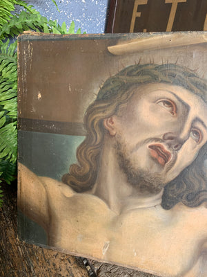 An original oil painting of Jesus on the cross