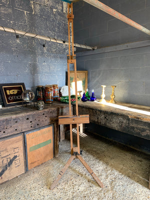 A floor standing wooden artist's easel by Winsor and Newton