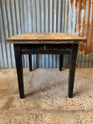 A Victorian scrubbed pine kitchen or dining table with ebonised legs