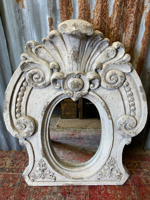 A large oeil de boeuf mirror